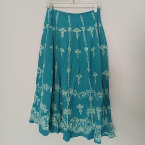 Turquoise colored flowy maxi/midi skirt with sequins